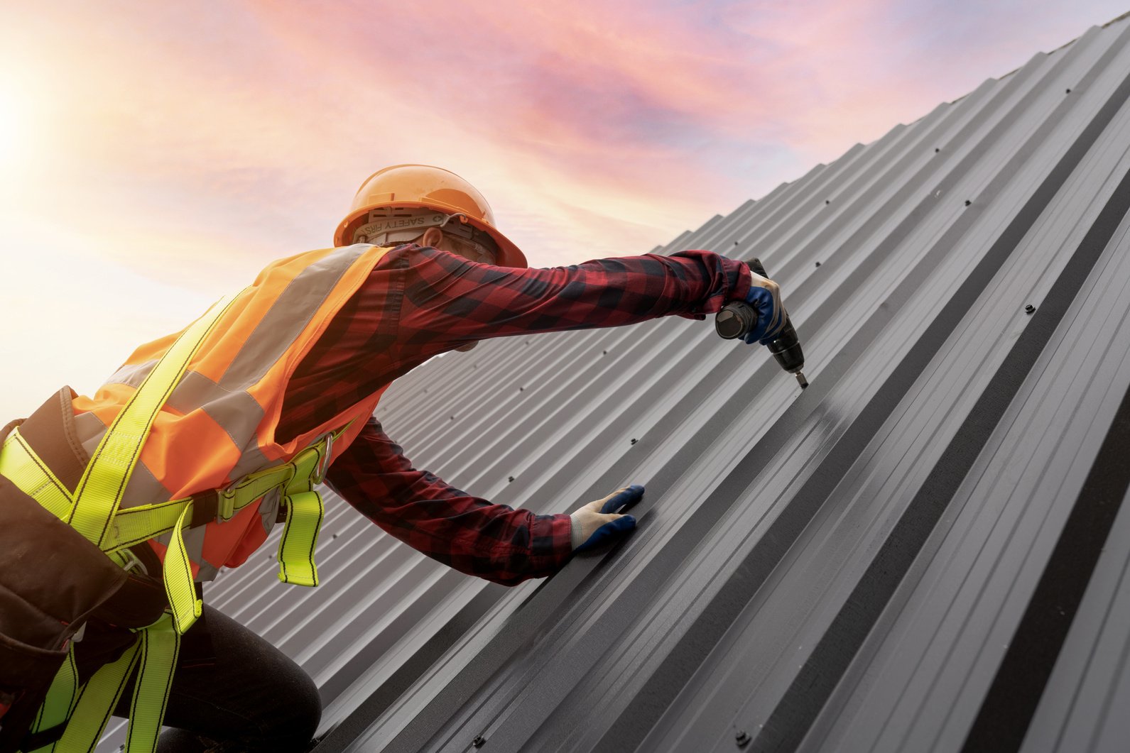 Roofer Installing Metal Roofing